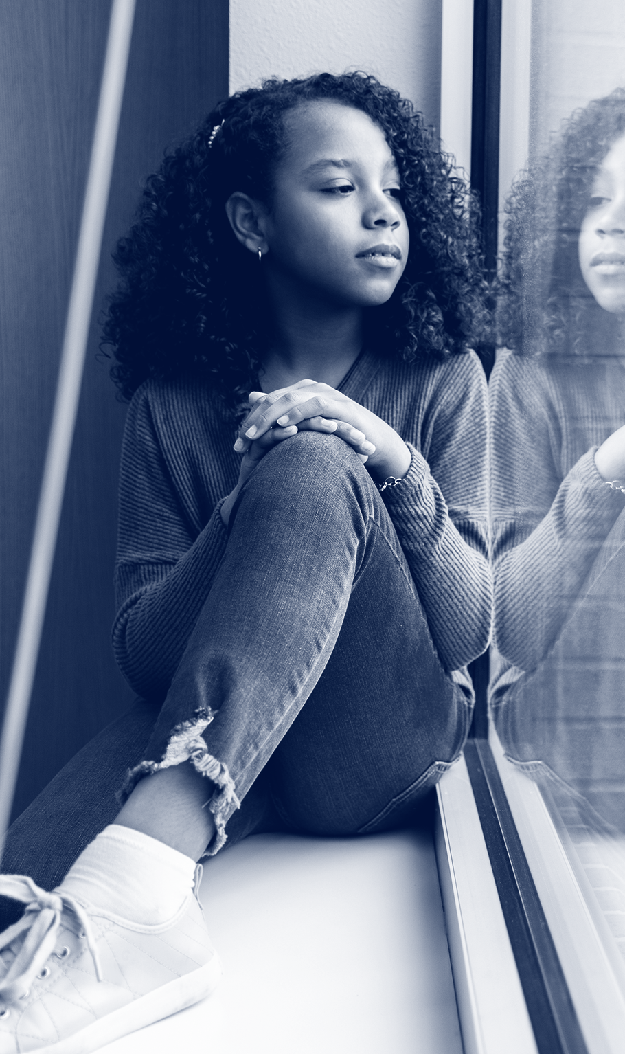 girl looking out window